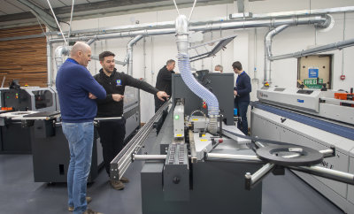 A photo of the R&J team demoing an Altendorf panel saw