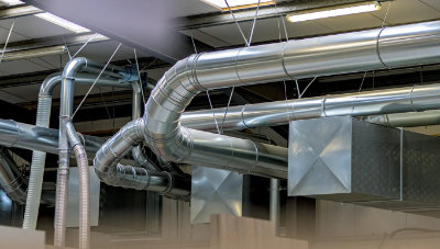 A photo of dust extraction ducting in a workshop
