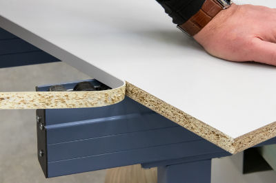 An image of an edge being peeled from an MDF panel