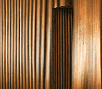 A close-up photo of a wooden detail finish courtesy of the Vitap Acoustic machine